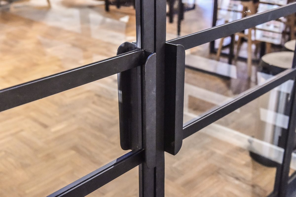 Loft Door Handle at Adidas Runners Club in Warsaw made of black structural steel