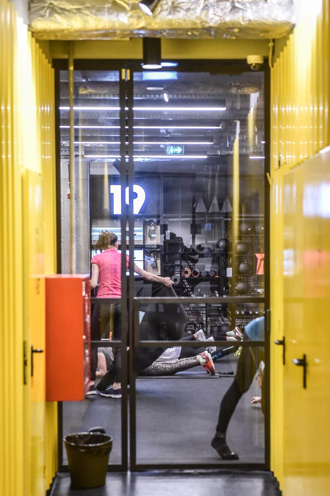 Loft doors Black Metal Closed in yellow corridor in Adidas Runners Warsaw